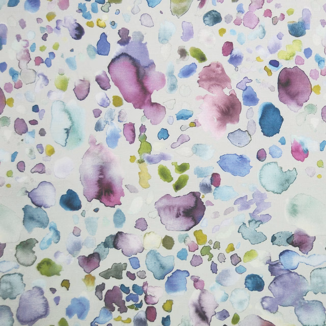 Watercolour abstract fabric with lilac, blue and green spots on a pale ground