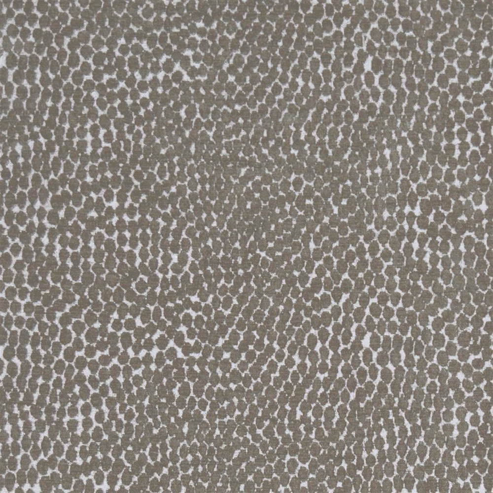 Close-up of pebble brown patterned fabric with pale speckled spots