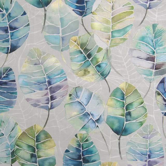 Painterly leaf fabric in blue, aqua and green on a pale ground