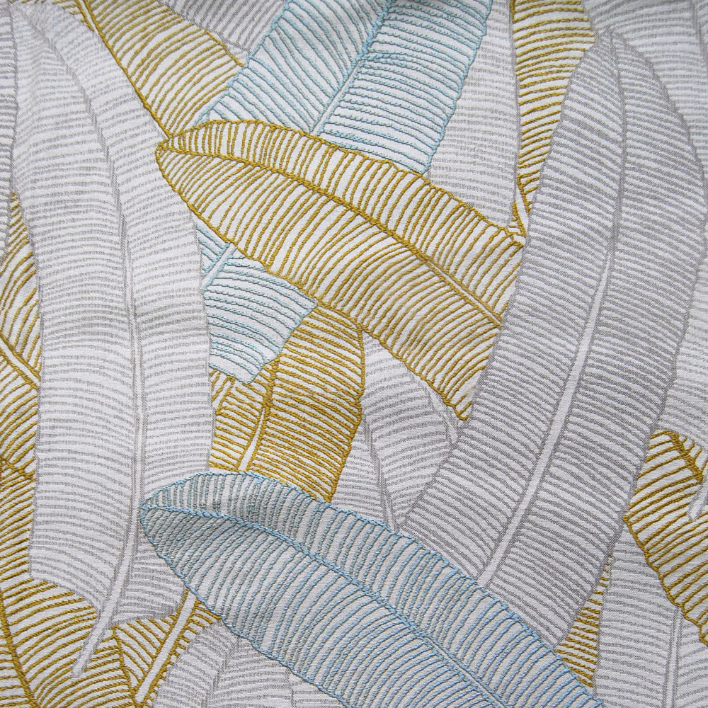 Close-up of Daxby Multi fabric showing pale grey woven leaf bands with gold and aqua accents