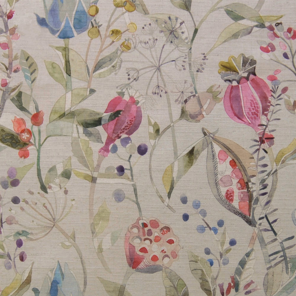 Painterly floral fabric with blush pink blossoms, sage leaves and lilac accents on a pale ground