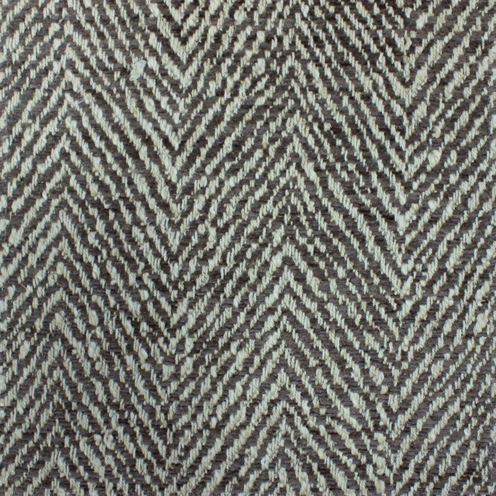 Close-up of grey herringbone woven fabric with pale marl highlights
