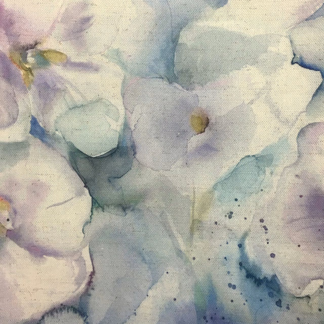 Painterly lilac, sage and blue floral fabric with a soft woven texture
