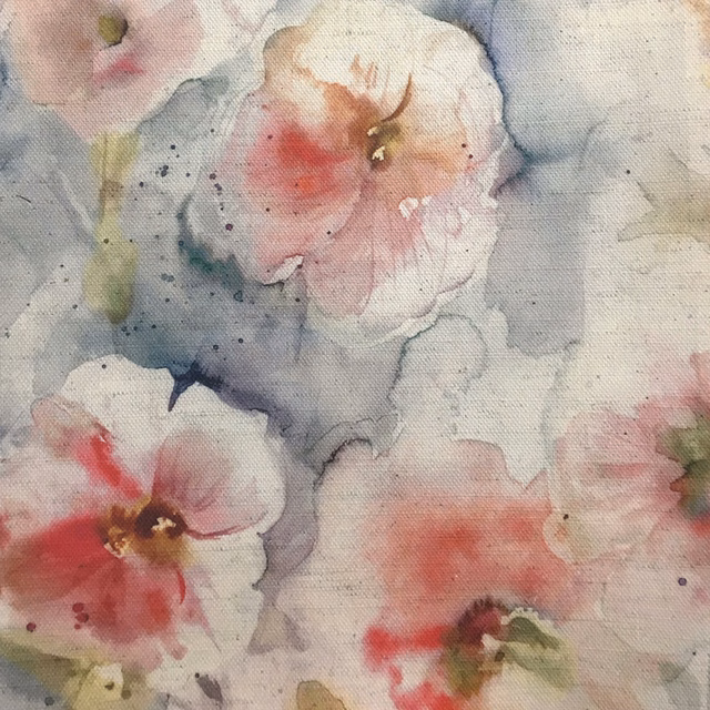Painterly floral fabric with soft red and blush blooms on a pale grey ground