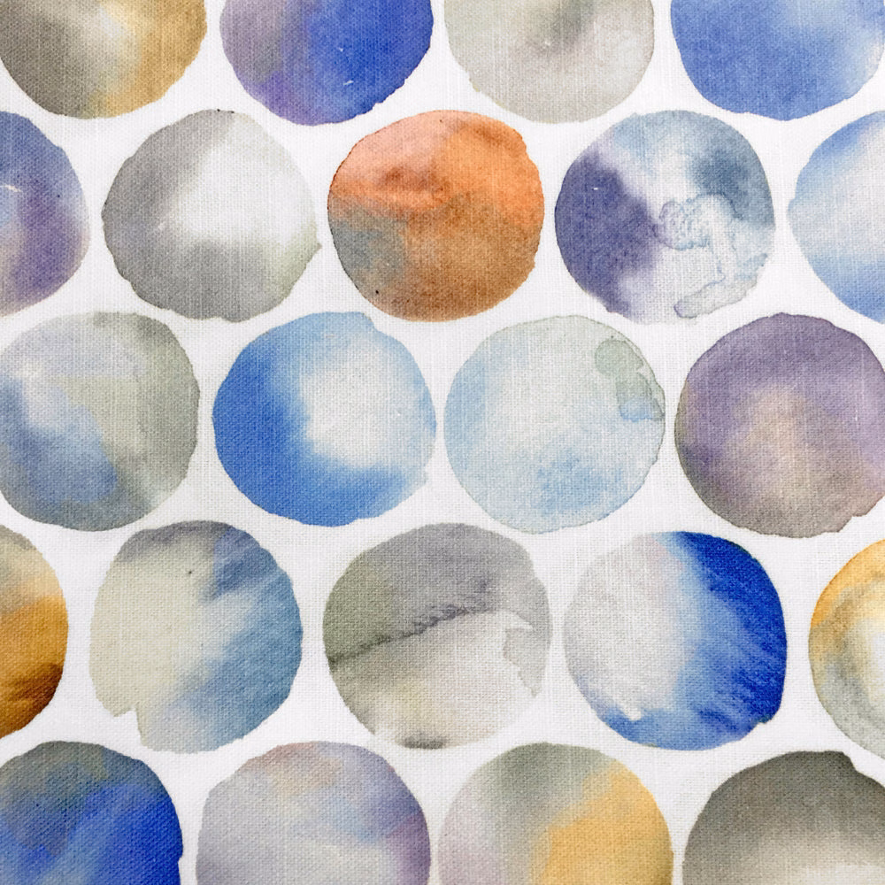 Watercolour polka dot fabric in blue, lilac and grey on white ground