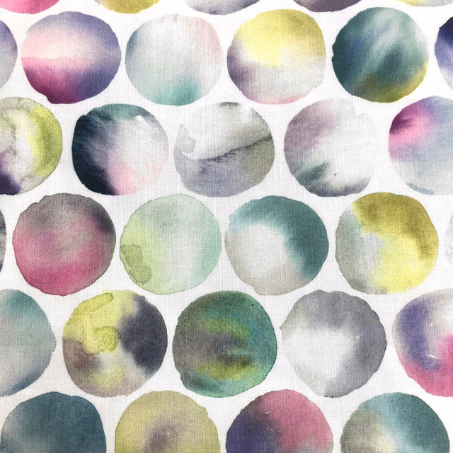 Painterly multicolour circle print on a pale ground with soft pink, aqua, lime and grey tones