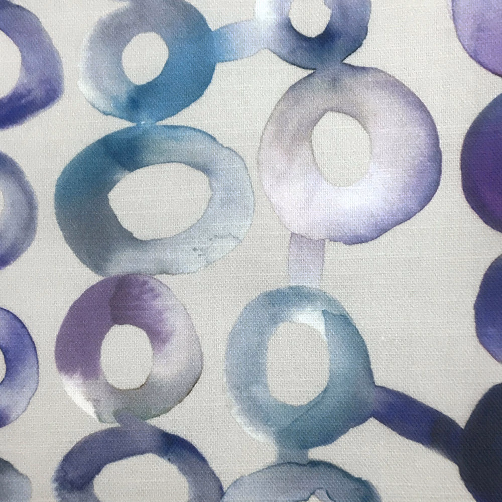 Abstract painterly ring pattern in cool purple, lilac and blue on pale ground