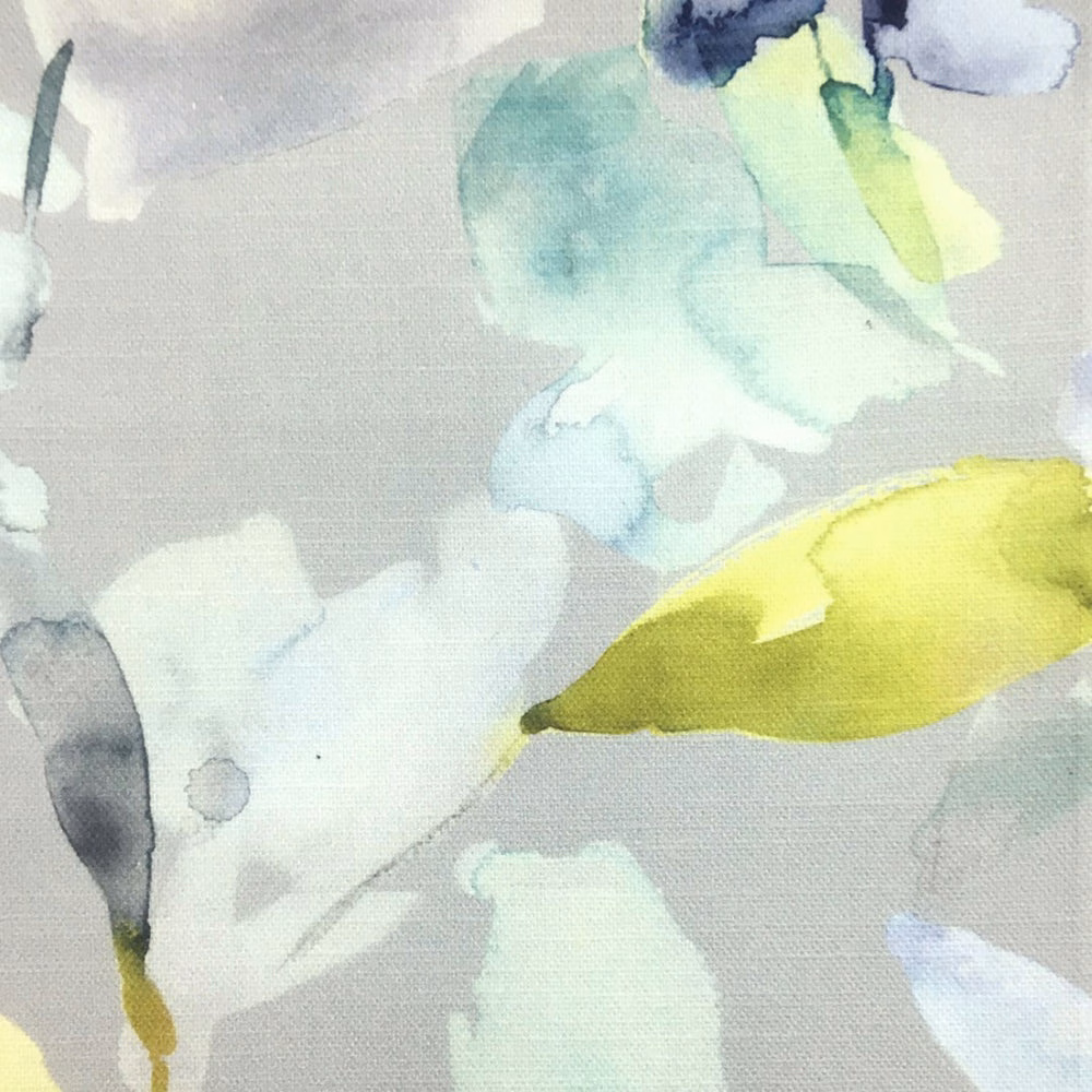 Abstract watercolor-style fabric with aqua, mint and yellow-green shapes on stone ground