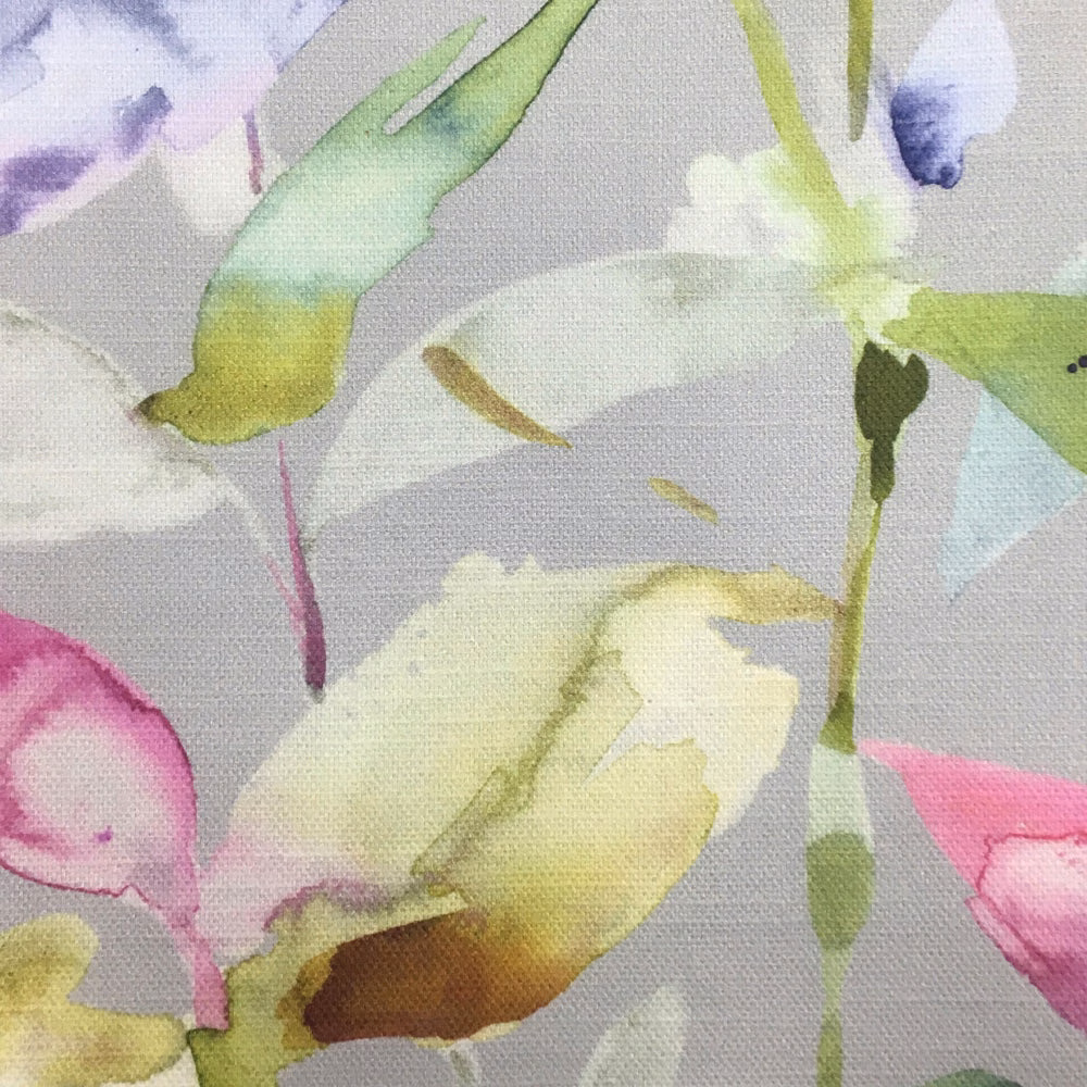 Watercolour floral fabric in soft pink, lilac, lime and cream on a grey ground