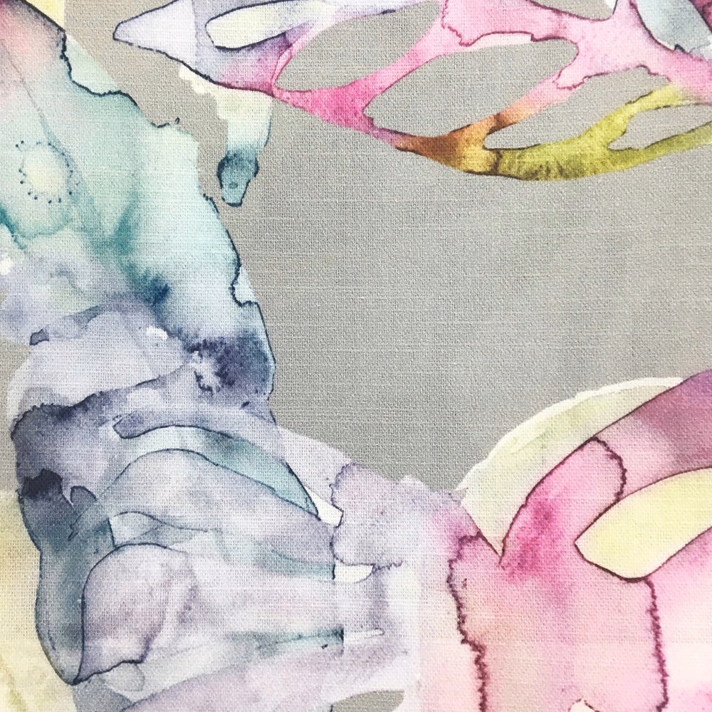 Abstract painterly fabric swatch with blush pink, lilac and aqua washes on a pale ground