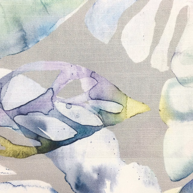 Abstract floral swatch in soft lavender, blue, mint and pale yellow on beige linen-like ground