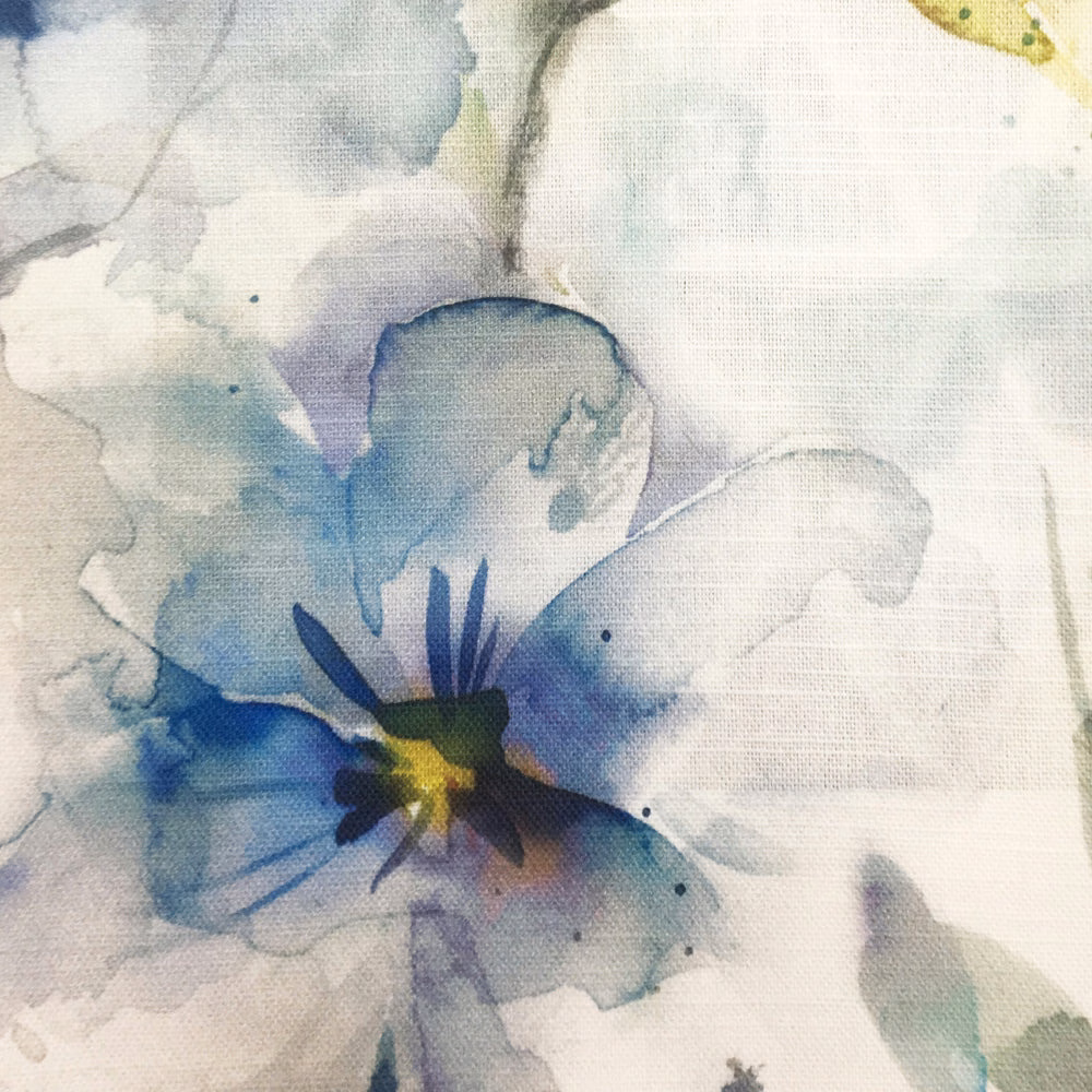 Watercolour blue floral fabric with pale ground and indigo centre detailing