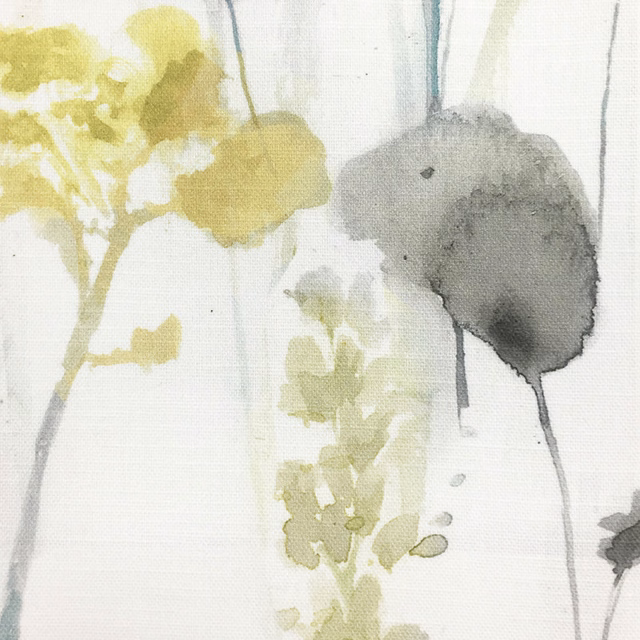 Pale botanical fabric swatch with soft mustard yellow and grey painted leaves