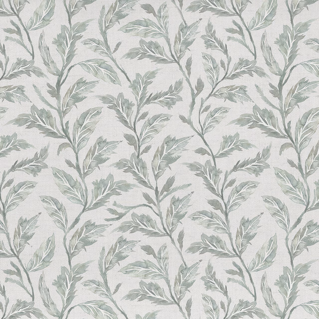 Pale beige botanical fabric with soft sage leaf trails on a woven ground