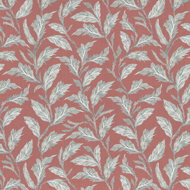 Terracotta orange botanical fabric with pale leaf motif and woven texture