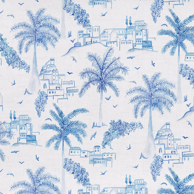Blue palm tree and coastal village print on pale cotton fabric