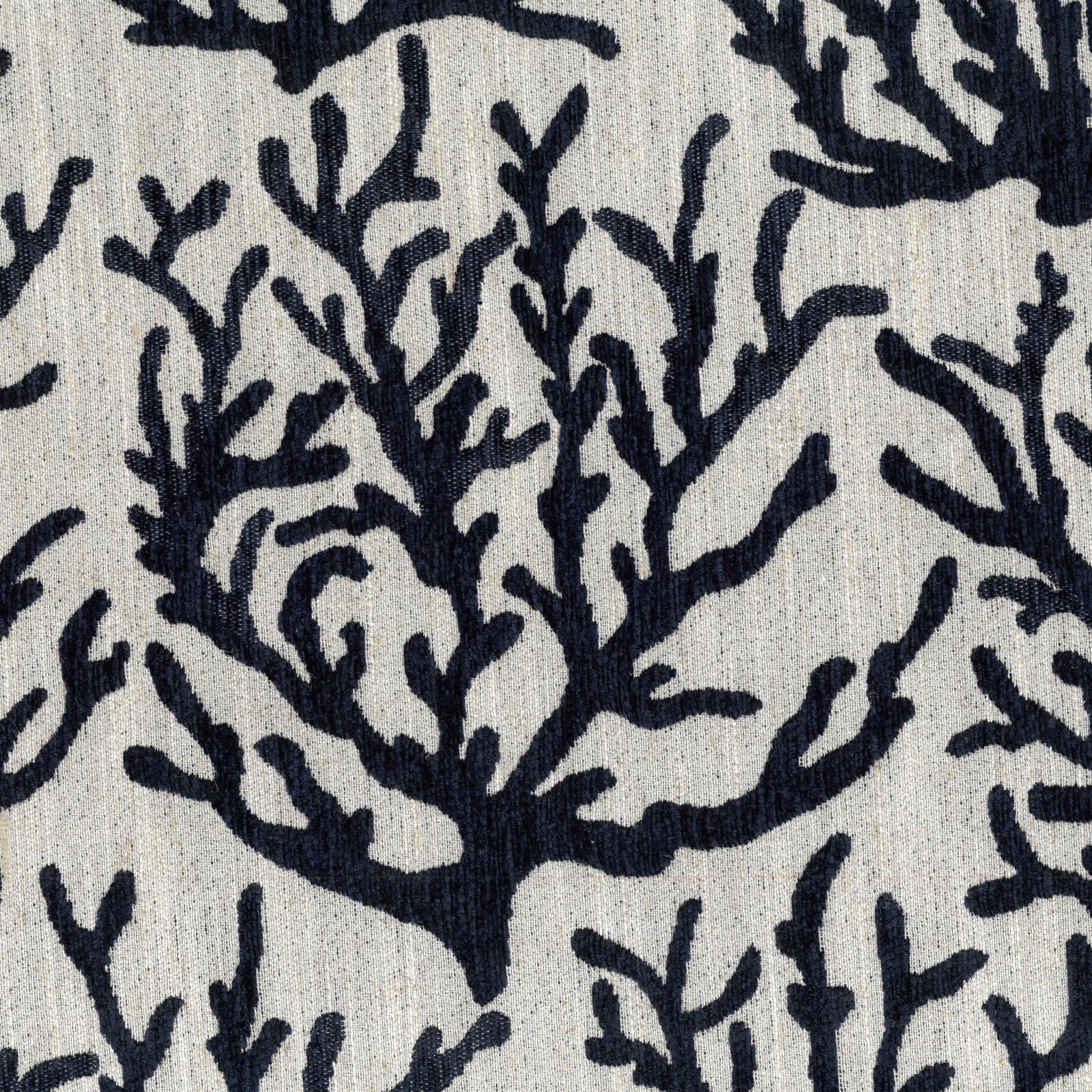 Close-up of lagoon blue coral motif on a pale textured woven fabric
