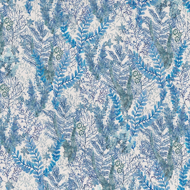 Blue botanical cotton fabric with fern-like stems and leafy sprays on a pale ground