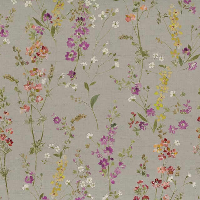 Pale ground floral fabric with scattered orange, pink, purple and yellow blossoms