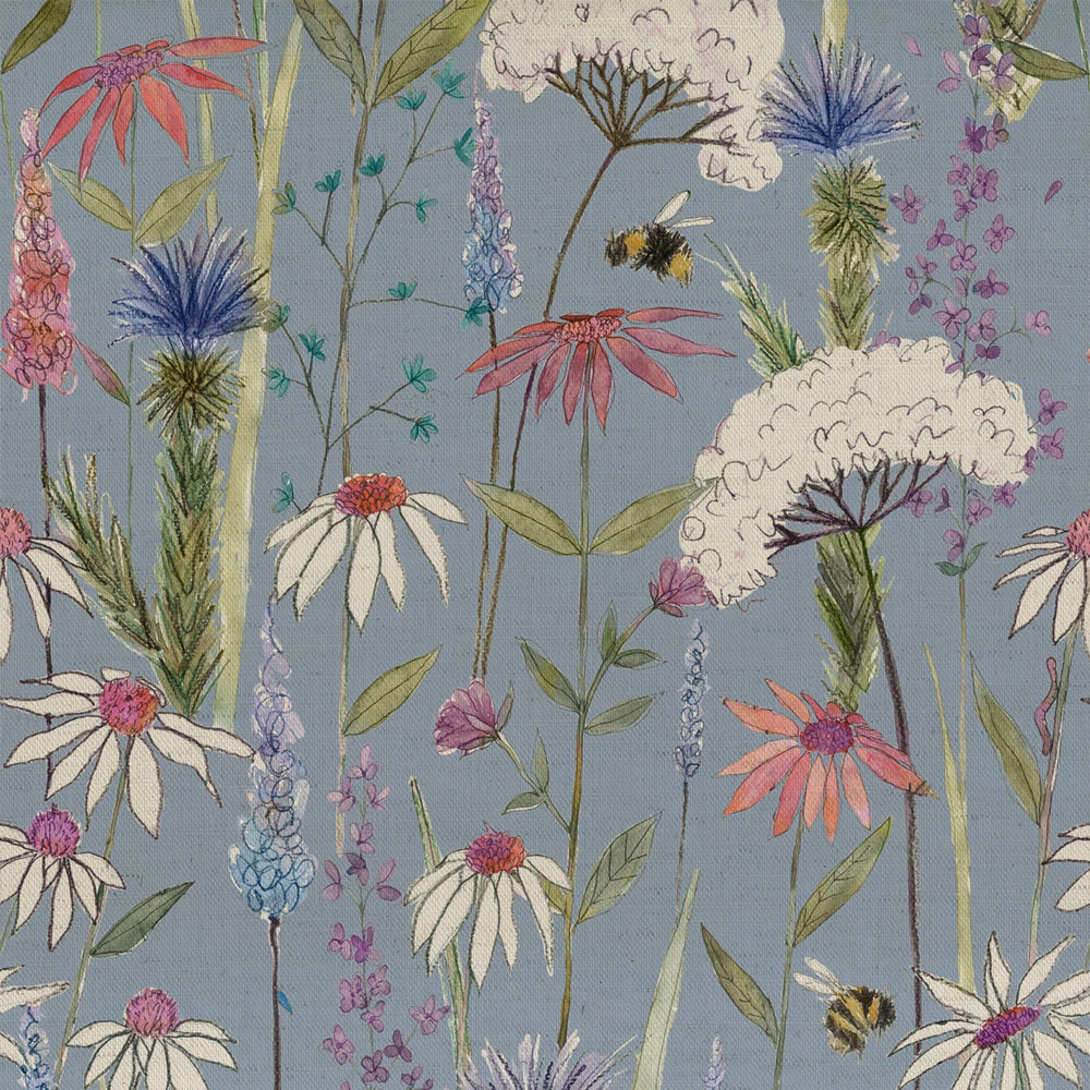 Dusty blue floral fabric with embroidered-style wildflowers and meadow stems
