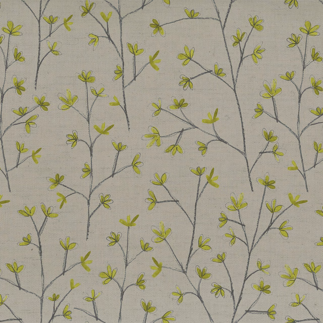 Pale botanical fabric with lime-green leaves and fine grey branching stems