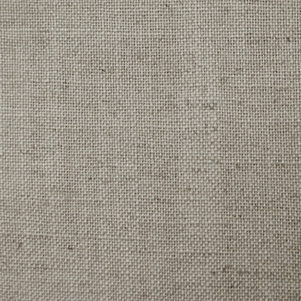 Close-up of warm cream plain weave fabric with fine linen-like texture