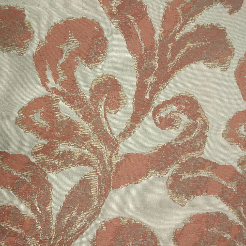 Large scrolling damask motif in muted terracotta orange on a pale woven ground