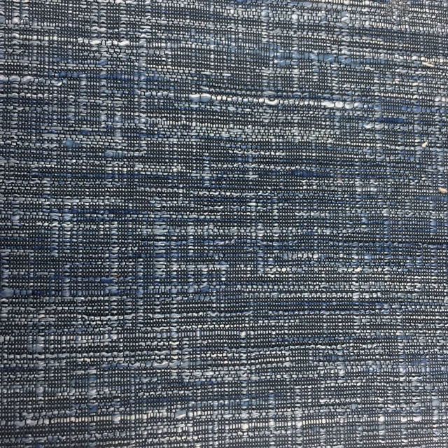 Textured slate blue woven fabric swatch with light flecked threads