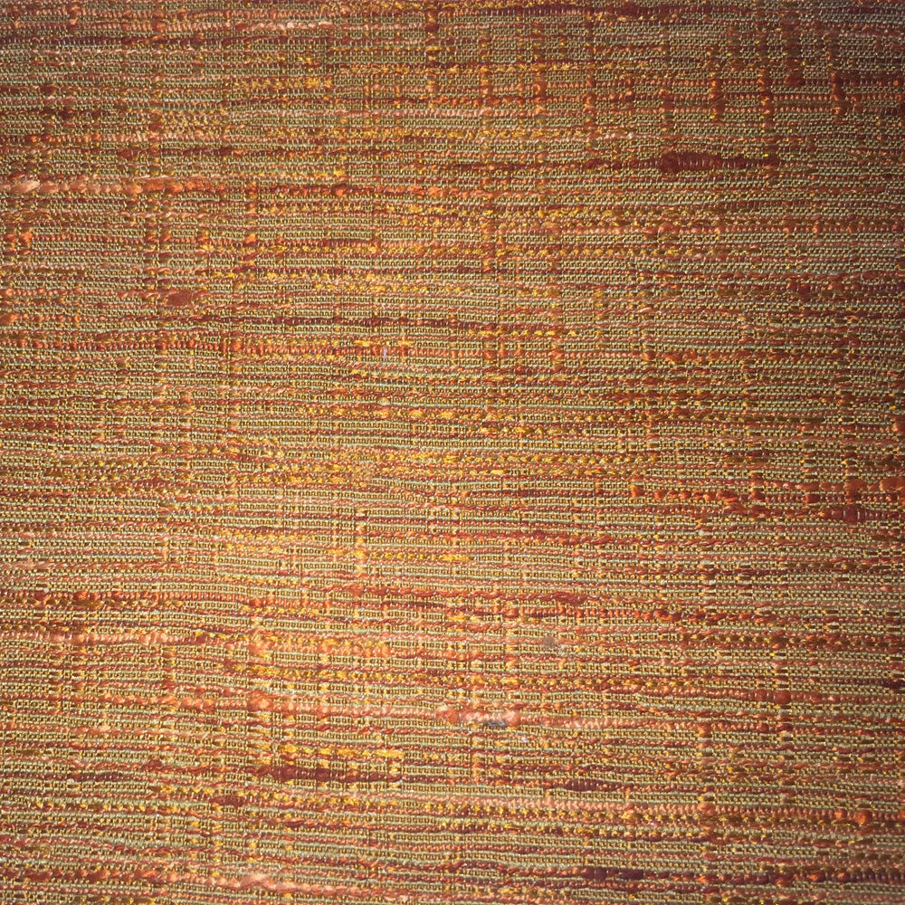 Textured orange and gold woven fabric with horizontal slubbed strands