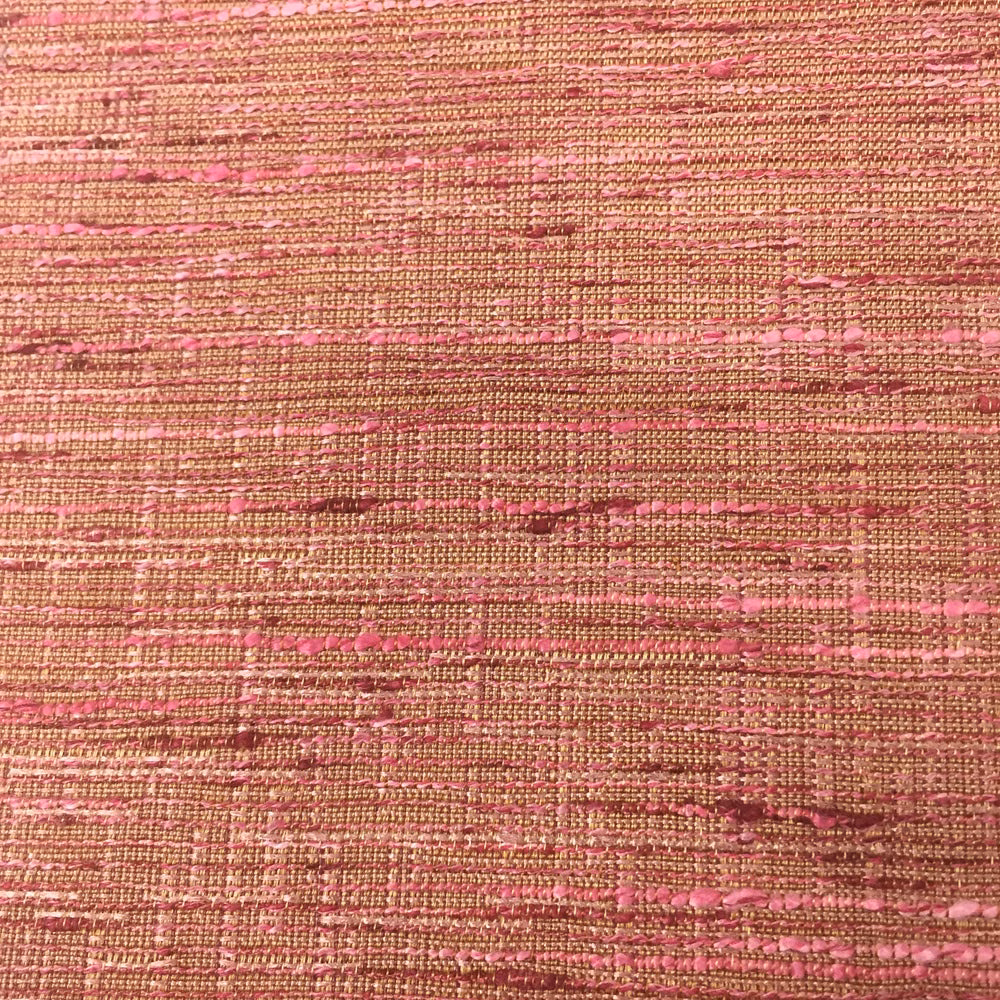 Close-up of a woven terracotta-red fabric with pink slubbed horizontal striations