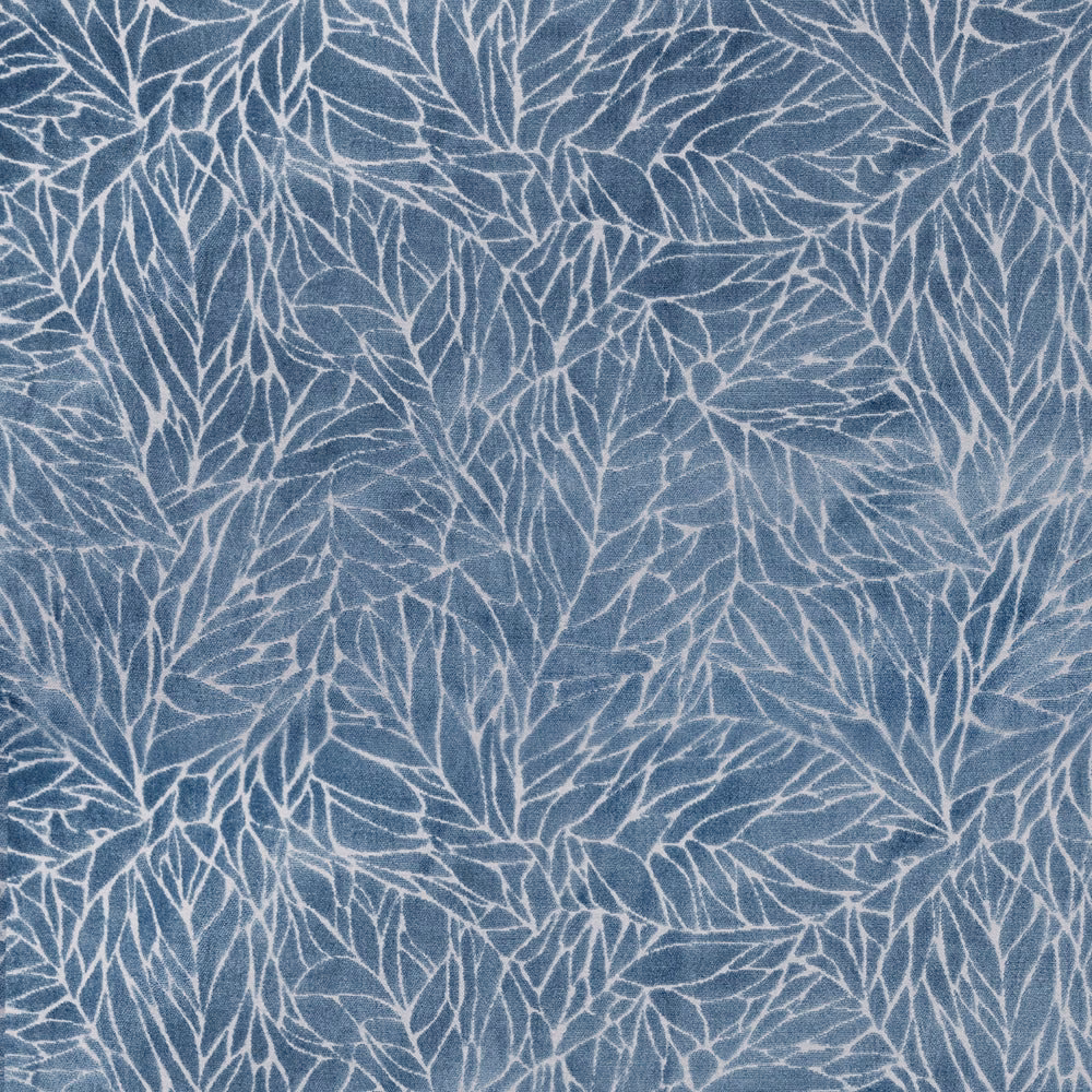 Blue botanical fabric with pale leaf outlines and a soft woven texture