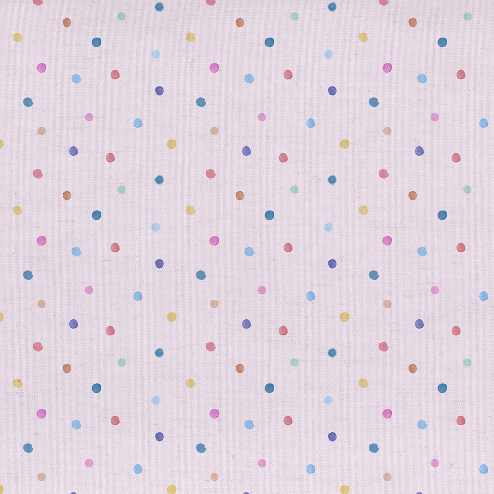 Pale blush pink fabric with scattered multicoloured polka dots on a fine woven ground