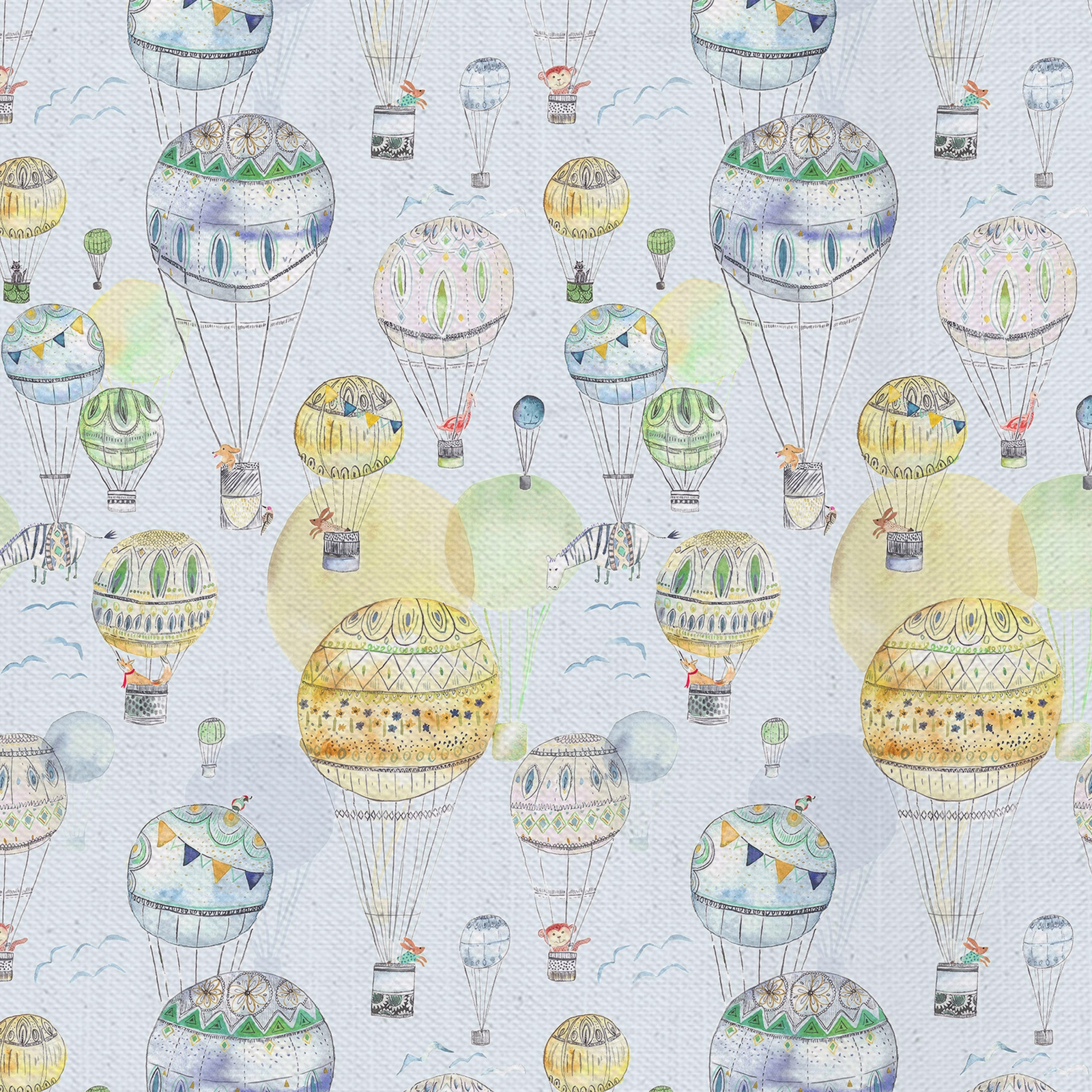 Patterned fabric with yellow hot-air balloons on a pale ground, printed with soft sketchy detail