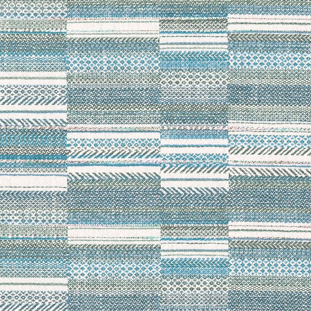Aqua blue woven patchwork fabric with stripes, checks and geometric blocks