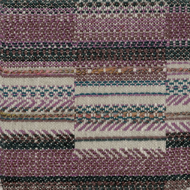 Close-up of a plum purple geometric woven fabric with cream and dark teal accents