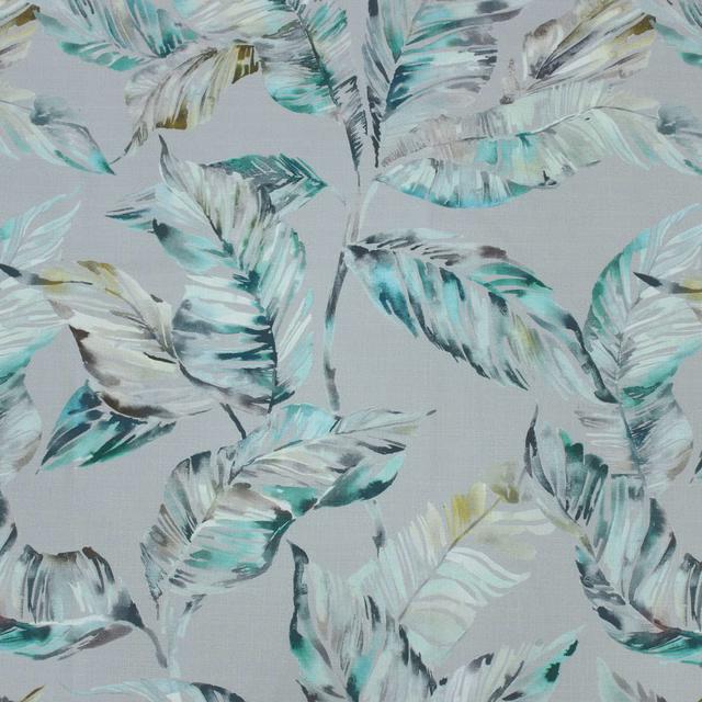 Painterly leafy fabric in sage, aqua, grey and charcoal on a pale ground