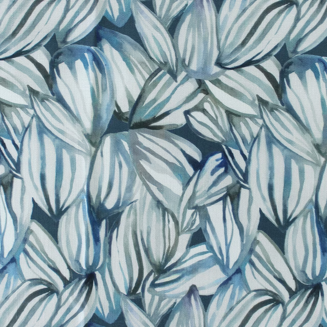 Close-up of blue and white botanical leaf print on woven fabric