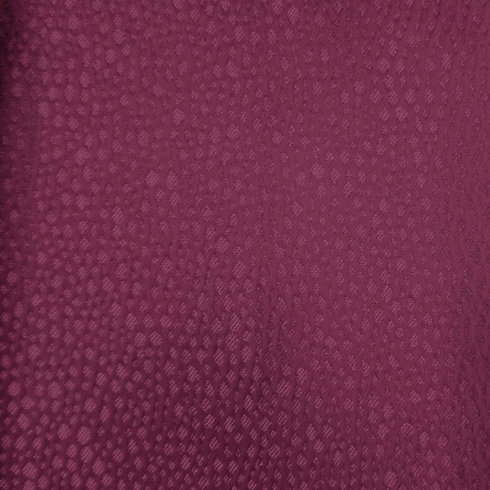 Deep berry pink textured fabric with small-scale woven abstract pattern