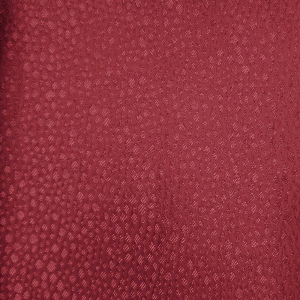 Deep berry red textured fabric swatch with a small woven dappled pattern
