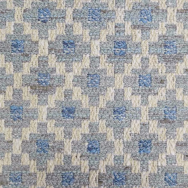 Close-up of a small geometric weave in grey, cream and muted blue