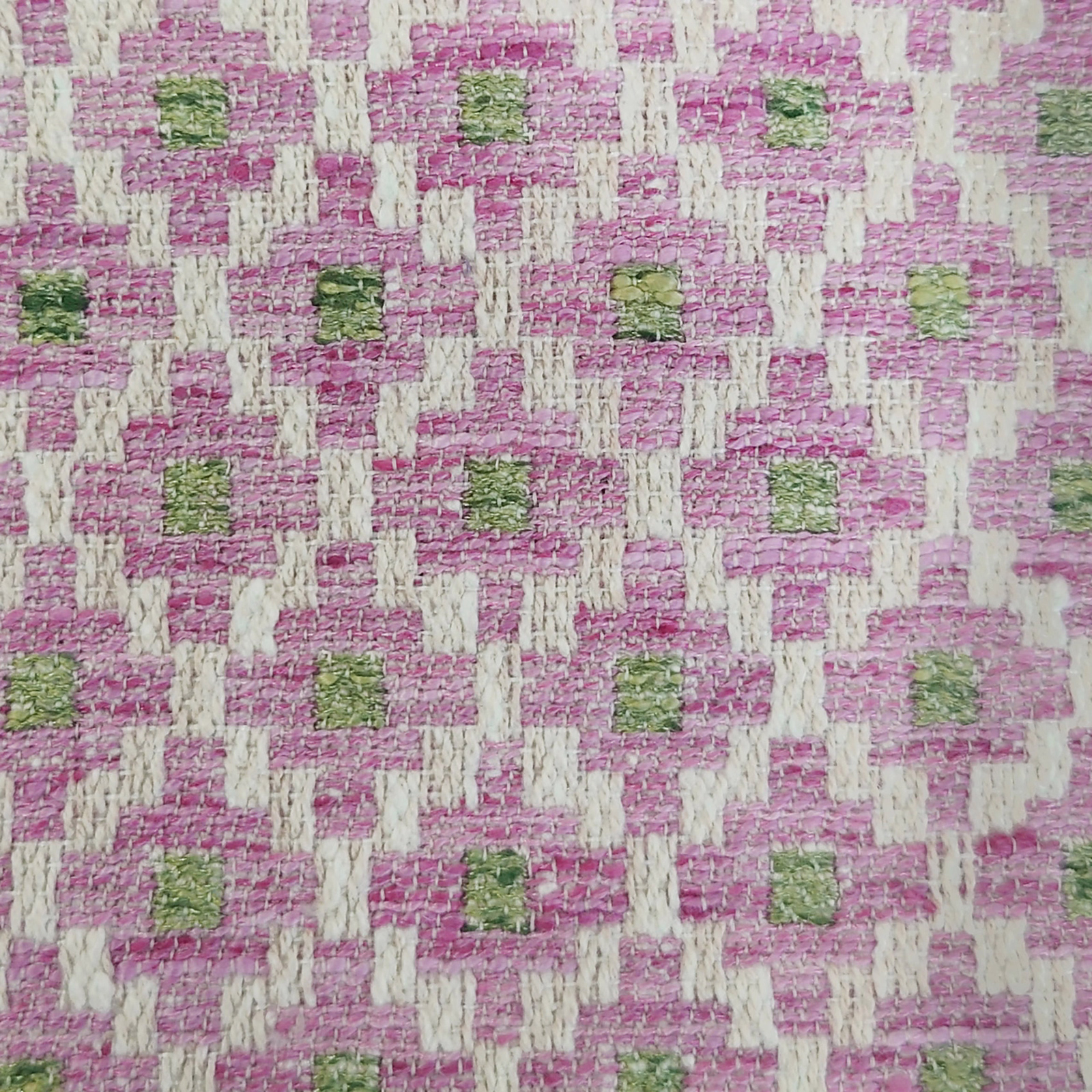 Pink and ivory geometric woven fabric with small green square accents