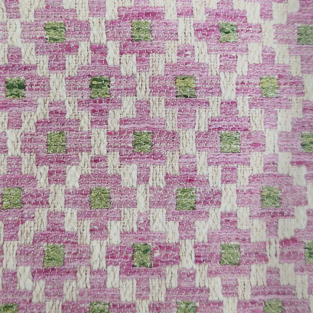 Pink and ivory geometric woven fabric with small green square accents