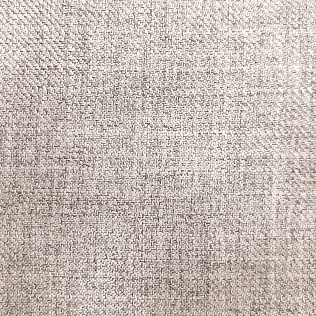 Close-up of soft warm cream woven fabric with fine textured basket-like weave