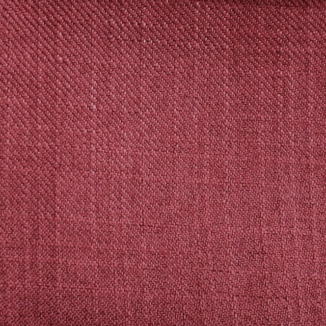 Close-up of a deep raspberry red woven fabric with a tight plain weave