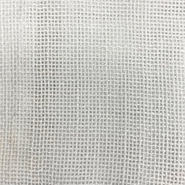 Close-up of soft chalk-white open weave fabric with a fine grid texture