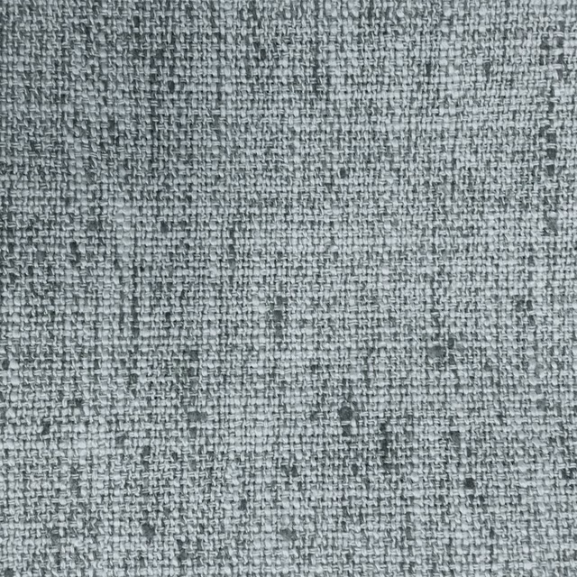 Close-up of cool grey woven fabric with a textured, speckled surface