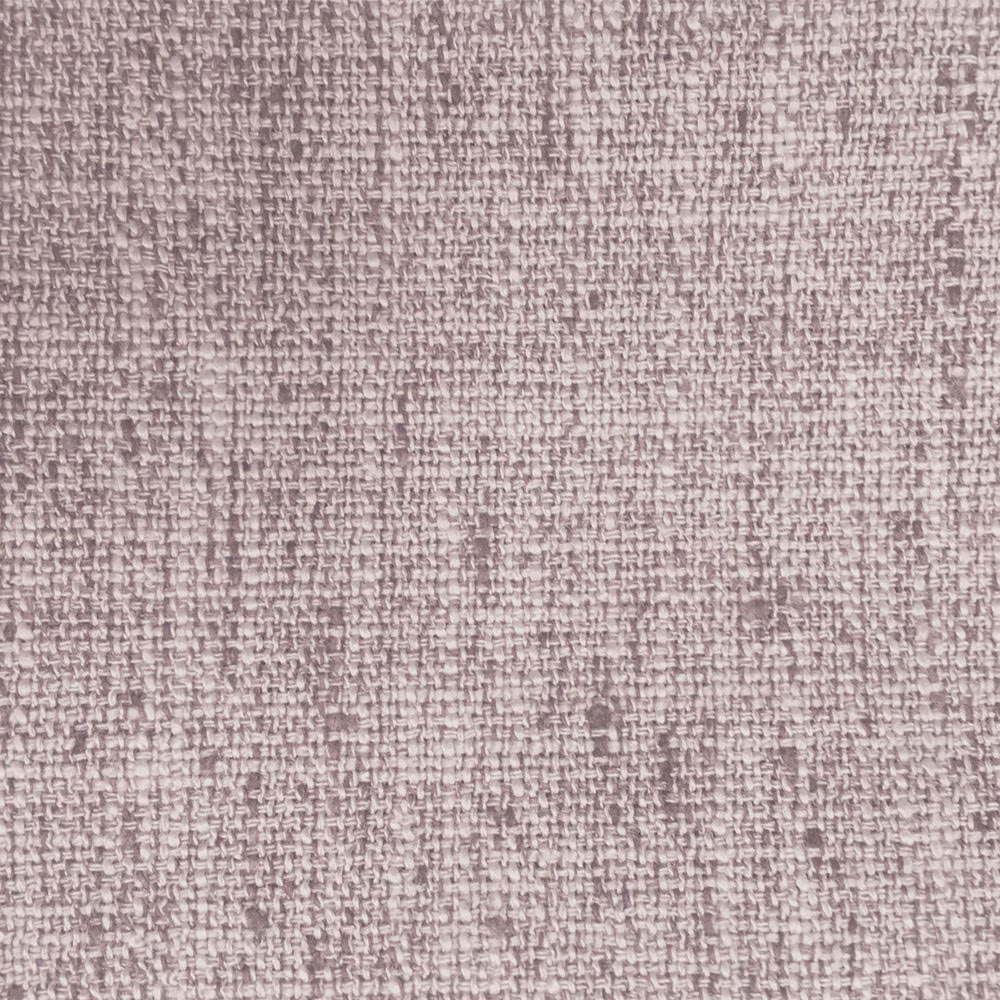 Close-up of a soft dusty pink woven fabric with fine textured surface