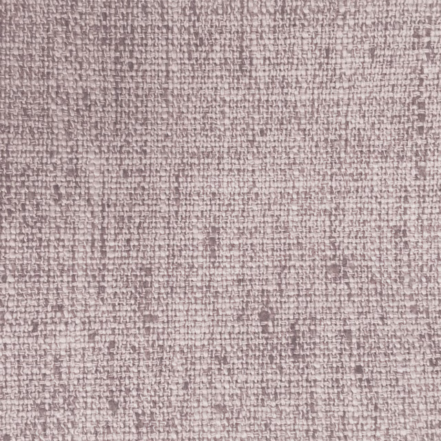Close-up of a soft dusty pink woven fabric with fine textured surface