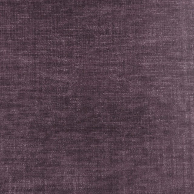 Close-up of muted plum-purple fabric with soft textured weave
