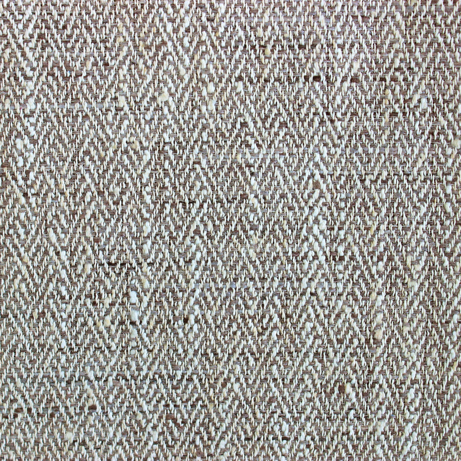 Close-up of a brown and taupe textured woven fabric swatch